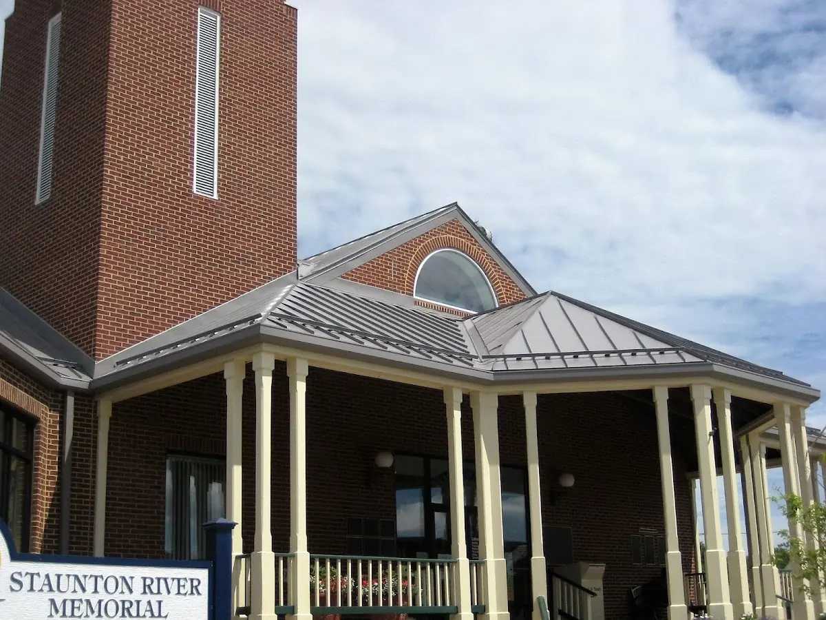 Skilled roofing craftsmen working on a residential roof in Jackson